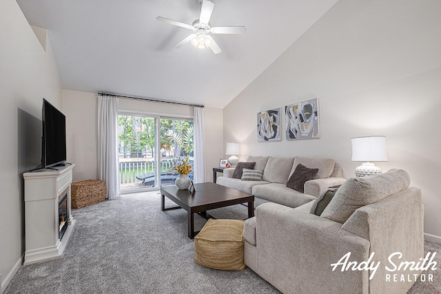 319 Nestlewood Dr Unit 3, Holland, MI 49424 - living room with carpet floors, ceiling fan, high vaulted ceiling, a glass covered fireplace, and baseboards