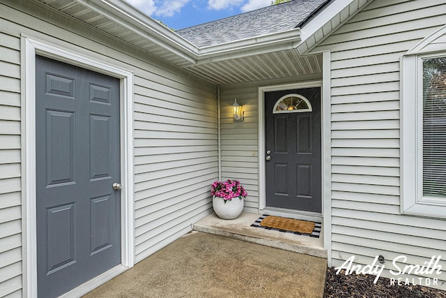 319 Nestlewood Dr Unit 3, Holland, MI 49424 - property entrance with a shingled roof