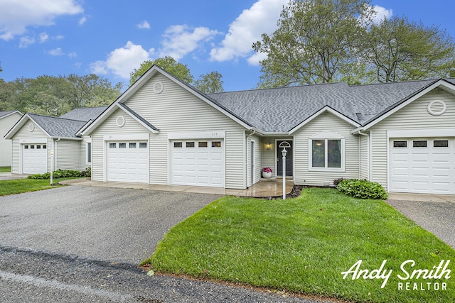 319 Nestlewood Dr Unit 3, Holland, MI 49424 - ranch-style house with driveway, a garage, roof with shingles, and a front lawn