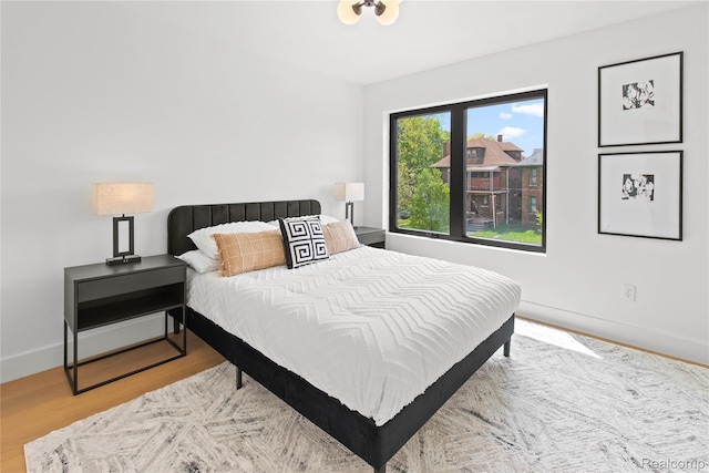 7614 Kipling Unit 15, Detroit, MI 48206 - bedroom with baseboards and wood finished floors