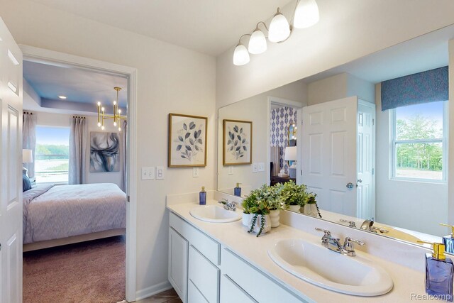 54724 Heron Cir, Chesterfield, MI 48047 - bathroom featuring ensuite bathroom, double vanity, and a chandelier
