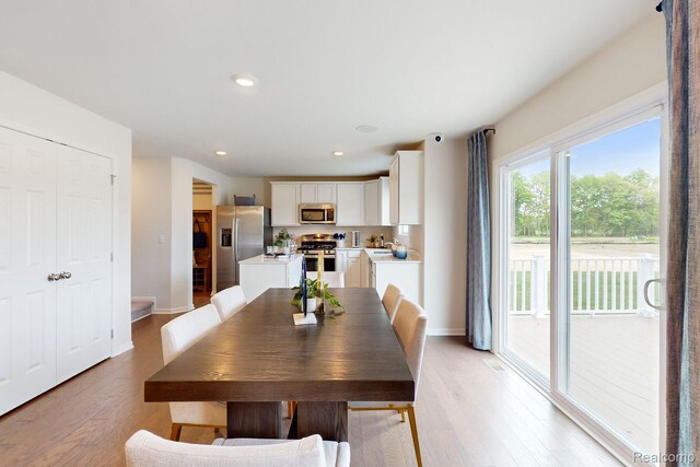 54724 Heron Cir, Chesterfield, MI 48047 - dining area featuring light wood-style flooring, recessed lighting, and baseboards