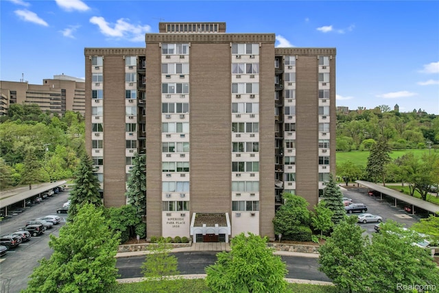 1050 Wall St Unit 8F, Ann Arbor, MI 48105 - view of apartment building / complex with uncovered parking