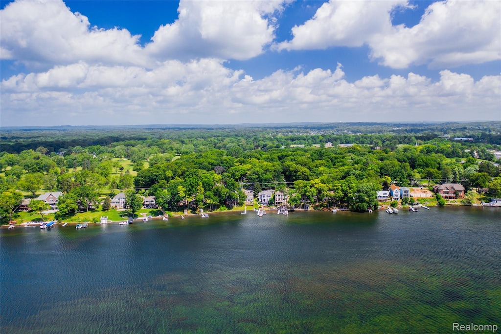 8605 Edgewood Park Dr, Commerce Twp, MI 48382 - drone / aerial view of a heavily wooded area and a nearby body of water