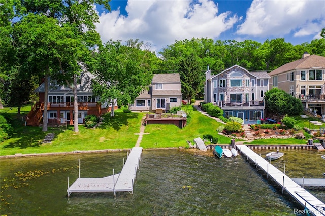 8605 Edgewood Park Dr, Commerce Twp, MI 48382 - dock featuring a yard and a deck with water view