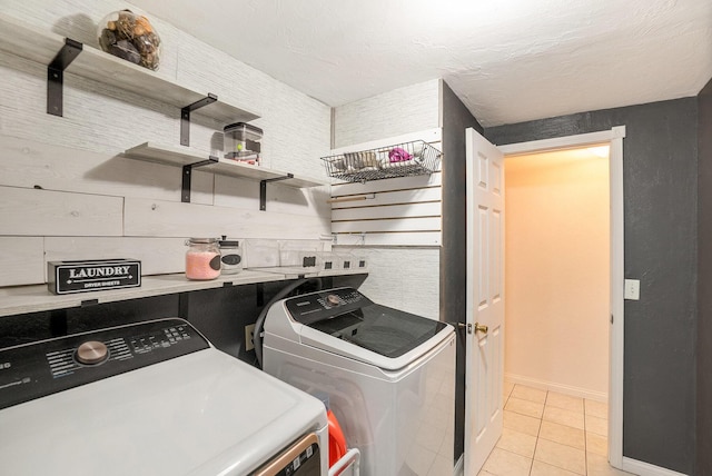 4958 Juniper Rdg, Newaygo, MI 49337 - washroom with washing machine and dryer, light tile patterned flooring, and baseboards