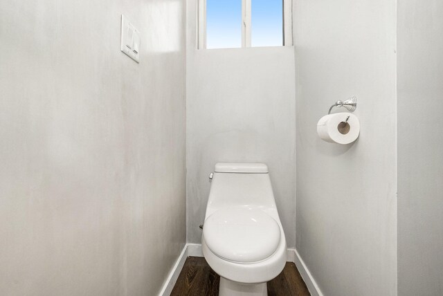 4958 Juniper Rdg, Newaygo, MI 49337 - bathroom featuring baseboards, toilet, and wood finished floors