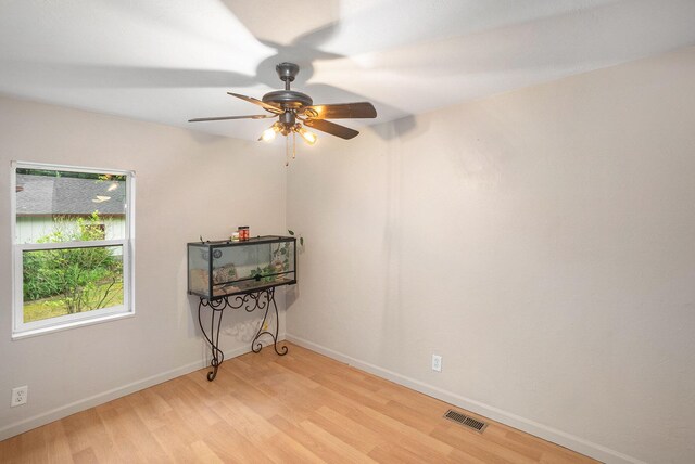 4958 Juniper Rdg, Newaygo, MI 49337 - unfurnished room featuring light wood-style flooring, ceiling fan, and baseboards