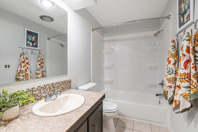 4958 Juniper Rdg, Newaygo, MI 49337 - bathroom with vanity, shower / bath combo, toilet, tile patterned floors, and tasteful backsplash