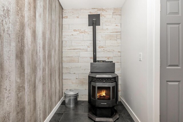 4958 Juniper Rdg, Newaygo, MI 49337 - detailed view of a wood stove, baseboards, and wood walls