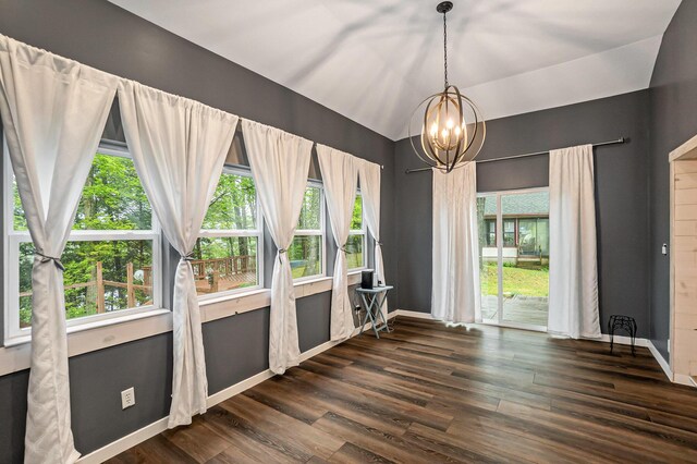 4958 Juniper Rdg, Newaygo, MI 49337 - unfurnished dining area with dark wood-style flooring, plenty of natural light, vaulted ceiling, a chandelier, and baseboards
