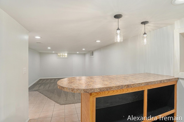 1046 Kenesaw Dr SE, East Grand Rapids, MI 49506 - kitchen featuring light tile patterned floors, light carpet, light countertops, recessed lighting, and baseboards