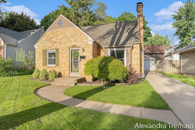 1046 Kenesaw Dr SE, East Grand Rapids, MI 49506 - view of front facade featuring brick siding, a detached garage, a chimney, roof with shingles, and concrete driveway