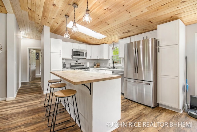 4527 Clareola Ave, Lake, MI 48632 - kitchen with appliances with stainless steel finishes, wooden counters, wood ceiling, lofted ceiling, and white cabinets