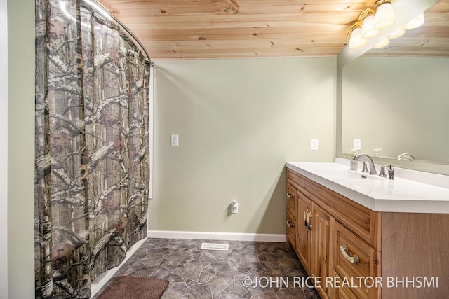4527 Clareola Ave, Lake, MI 48632 - bathroom featuring wood ceiling, vanity, marble finish floors, and baseboards