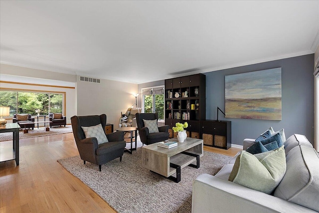 4047 Ramsgate Ct, Ann Arbor, MI 48103 - living room featuring wood finished floors and crown molding