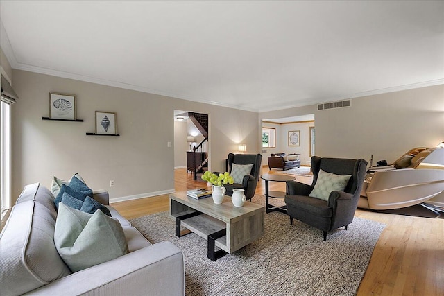 4047 Ramsgate Ct, Ann Arbor, MI 48103 - living room with stairway, crown molding, light wood finished floors, and baseboards