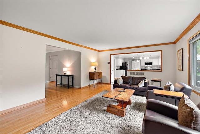 4047 Ramsgate Ct, Ann Arbor, MI 48103 - living room with light wood finished floors, crown molding, and baseboards