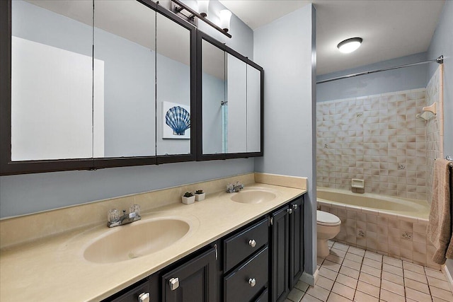4047 Ramsgate Ct, Ann Arbor, MI 48103 - full bathroom featuring toilet, double vanity, tile patterned flooring, and tiled shower / bath combo