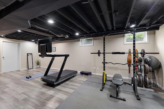 4047 Ramsgate Ct, Ann Arbor, MI 48103 - workout room with plenty of natural light, wood finished floors, and baseboards
