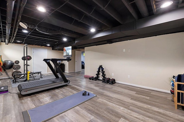 4047 Ramsgate Ct, Ann Arbor, MI 48103 - workout room with wood finished floors and baseboards
