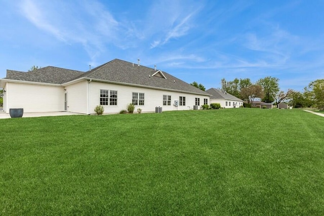 1732 Peachtree Path Unit 4, Stevensville, MI 49127 - back of property featuring a lawn, a patio area, and cooling unit