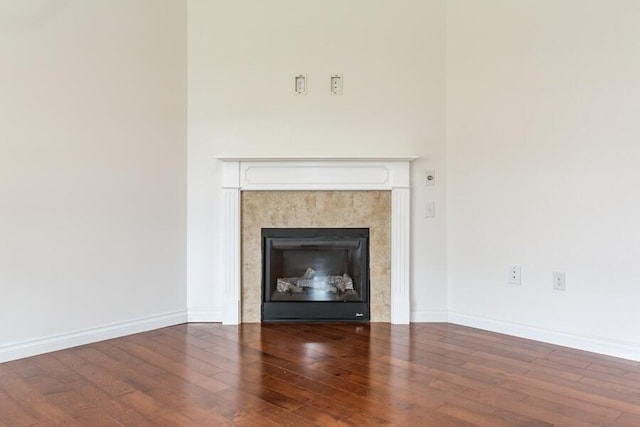 1732 Peachtree Path Unit 4, Stevensville, MI 49127 - detailed view of a tile fireplace, wood finished floors, and baseboards