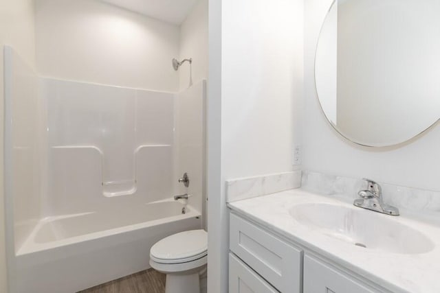 1732 Peachtree Path Unit 4, Stevensville, MI 49127 - bathroom featuring toilet, vanity, shower / washtub combination, and wood finished floors