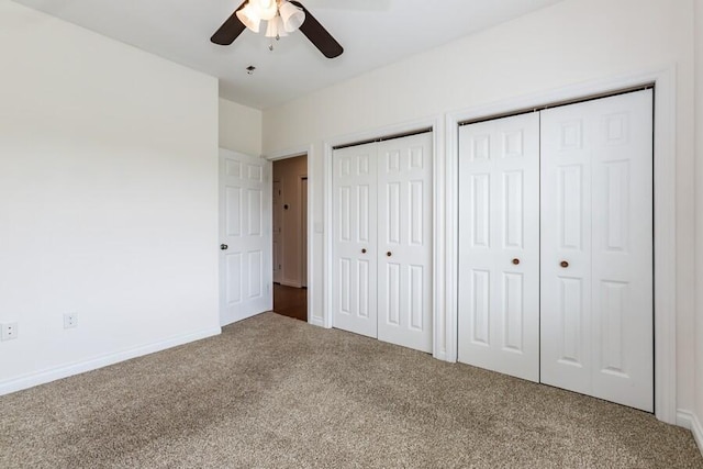 1732 Peachtree Path Unit 4, Stevensville, MI 49127 - unfurnished bedroom with carpet floors, multiple closets, baseboards, and a ceiling fan