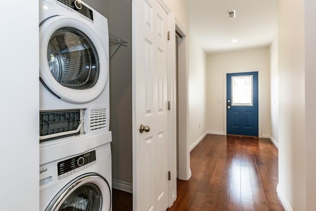 1732 Peachtree Path Unit 4, Stevensville, MI 49127 - laundry room featuring stacked washer and clothes dryer, wood-type flooring, and baseboards