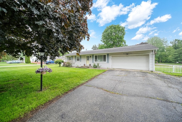 2837 Elmwood Dr, Adrian, MI 49221 - ranch-style home featuring a garage and asphalt driveway
