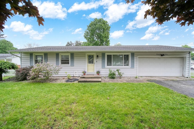 2837 Elmwood Dr, Adrian, MI 49221 - ranch-style home featuring asphalt driveway, a garage, and a front yard