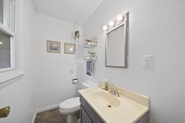 2837 Elmwood Dr, Adrian, MI 49221 - half bath featuring vanity, toilet, and baseboards