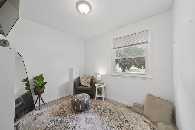 2837 Elmwood Dr, Adrian, MI 49221 - living area with baseboards and wood finished floors