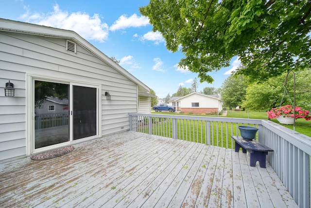 2837 Elmwood Dr, Adrian, MI 49221 - wooden deck featuring a lawn