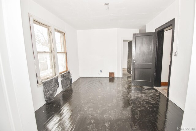 2688 Montgomery St, Detroit, MI 48206 - spare room with baseboards and hardwood / wood-style flooring