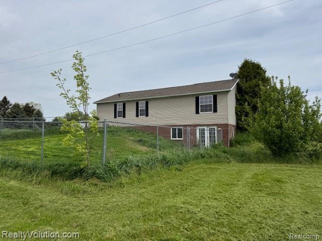 5736 Burnside Rd, North Branch, MI 48461 - view of property exterior featuring brick siding