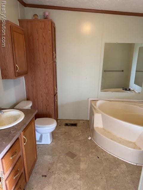 5736 Burnside Rd, North Branch, MI 48461 - full bathroom featuring vanity, a bath, toilet, crown molding, and a textured ceiling