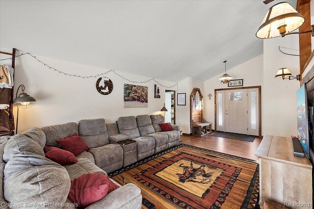5240 Thomas Rd, Metamora, MI 48455 - living area featuring wood finished floors and high vaulted ceiling