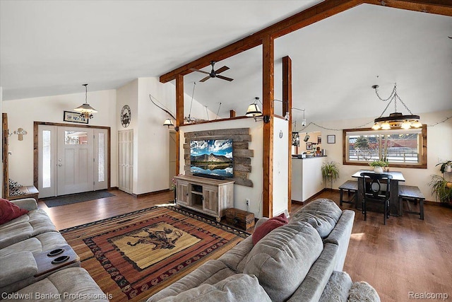 5240 Thomas Rd, Metamora, MI 48455 - living room with wood finished floors, ceiling fan, beam ceiling, baseboards, and high vaulted ceiling
