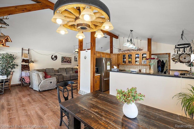 5240 Thomas Rd, Metamora, MI 48455 - dining area featuring wood finished floors and high vaulted ceiling