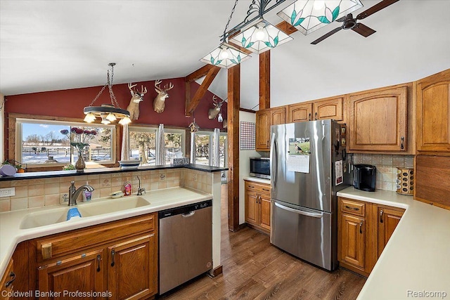 5240 Thomas Rd, Metamora, MI 48455 - kitchen featuring appliances with stainless steel finishes, backsplash, lofted ceiling, ceiling fan, and a sink