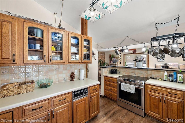 5240 Thomas Rd, Metamora, MI 48455 - kitchen featuring electric range, backsplash, brown cabinets, light countertops, and lofted ceiling