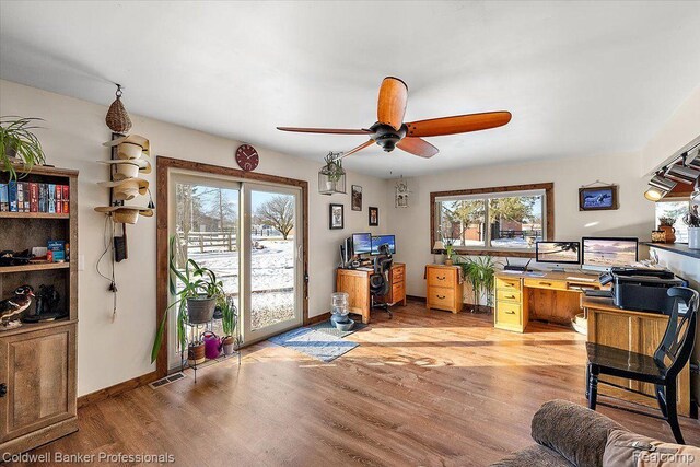 5240 Thomas Rd, Metamora, MI 48455 - office featuring healthy amount of natural light, ceiling fan, light wood finished floors, and baseboards