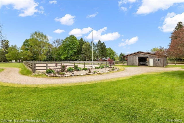 5240 Thomas Rd, Metamora, MI 48455 - view of grassy yard with an outbuilding, an exterior structure, a garage, and driveway