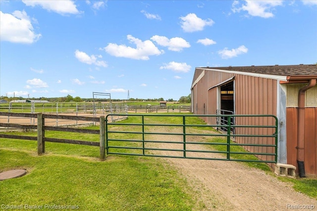 5240 Thomas Rd, Metamora, MI 48455 - gate featuring an exterior structure, a view of rural / pastoral area, and an outbuilding