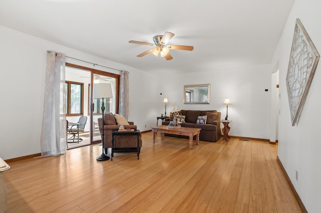8300 W X Ave, Schoolcraft, MI 49087 - living room with a ceiling fan, light wood-type flooring, and baseboards