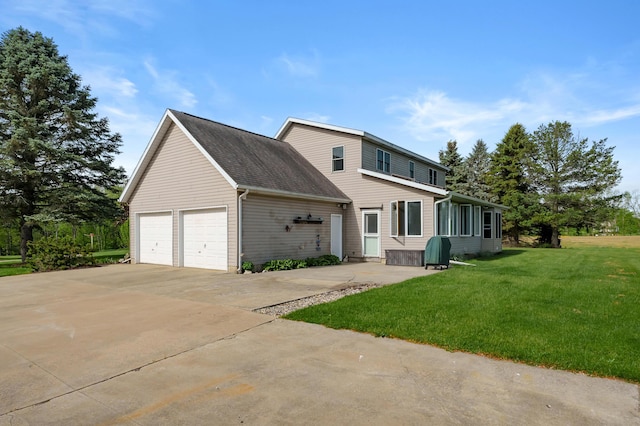 8300 W X Ave, Schoolcraft, MI 49087 - view of front of property with a front yard, a garage, and concrete driveway