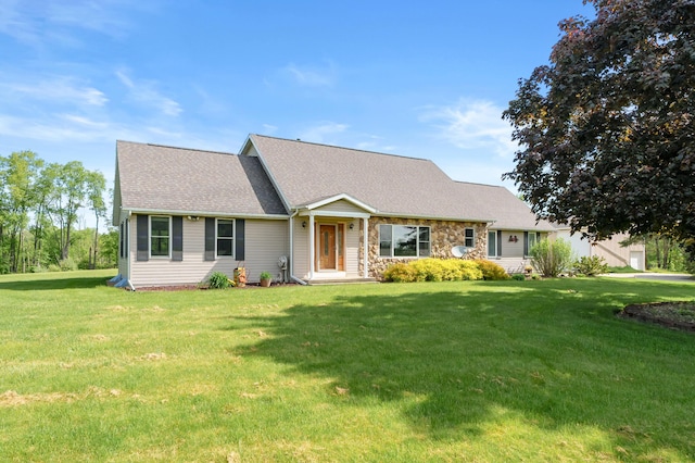 8300 W X Ave, Schoolcraft, MI 49087 - view of front of home featuring a front lawn, roof with shingles, and stone siding