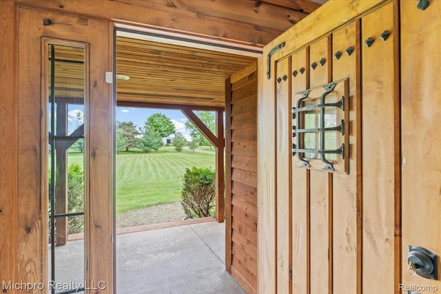 3434 Brown City Rd, Imlay City, MI 48444 - entryway with wooden ceiling, wooden walls, and unfinished concrete flooring